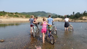 Us crossing the river with our bikes. Tess is on the left.